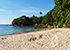 Haad Son (Secret Beach) auf Koh Phangan mit leicht bräunlichem Sand, Palmen und Bäumen